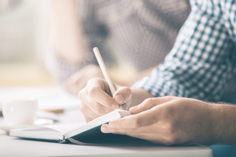 Hands Of A Man Writing